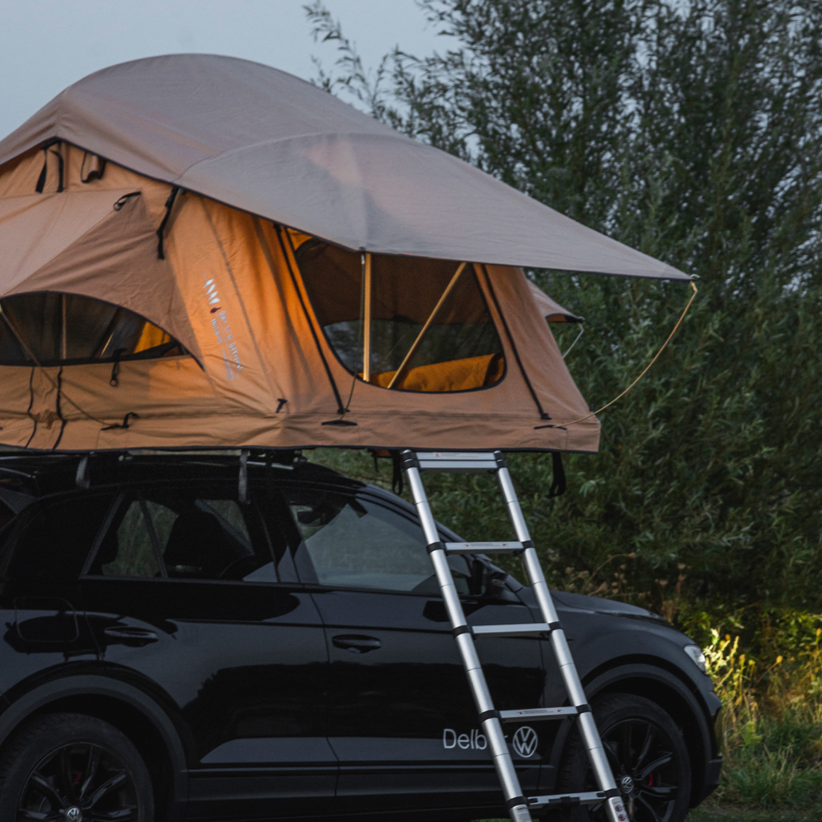 How does the ladder of my DTBD Outdoor rooftop tent work?